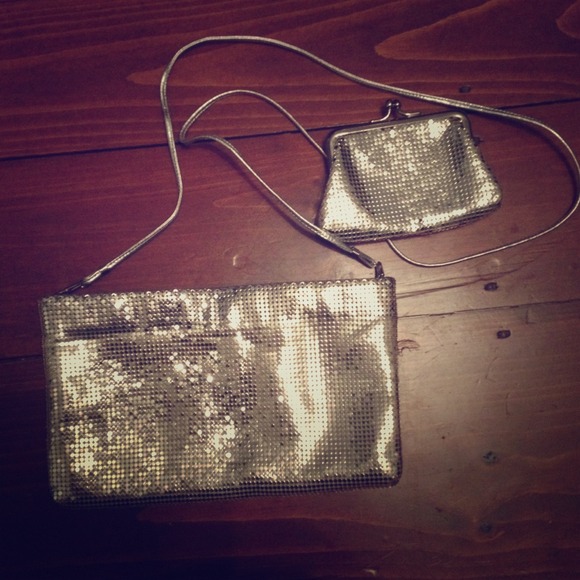 A silver shimmery purse with change purse included