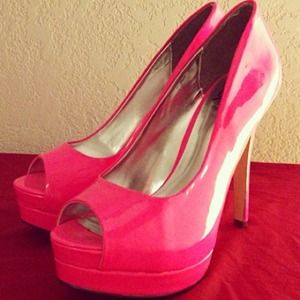 Neon pink peep toe pumps