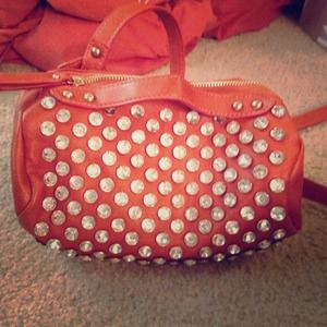 Brand new. Diamond stud burnt orange cross body