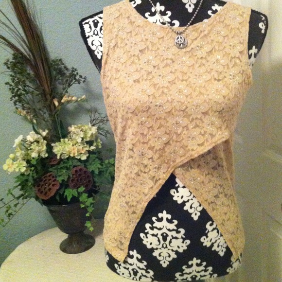 Tops - Cute and stretchy tan w/silver Lacey floral top.