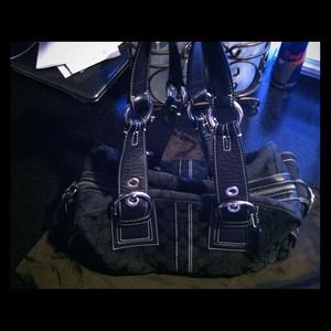 Large black coach with silver trimmings
