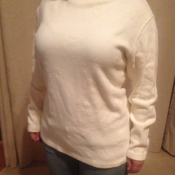 Ivory with floral print turtleneck sweater.