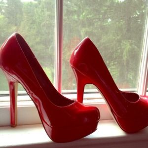 Brand new bright red stilettos