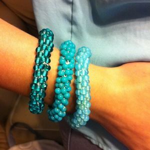 Very stylish set of 3 tone teal beaded bracelets.