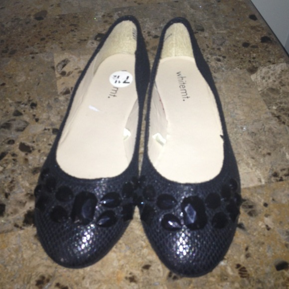 Black flats with black rhinestones on top