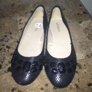 Black flats with black rhinestones on top