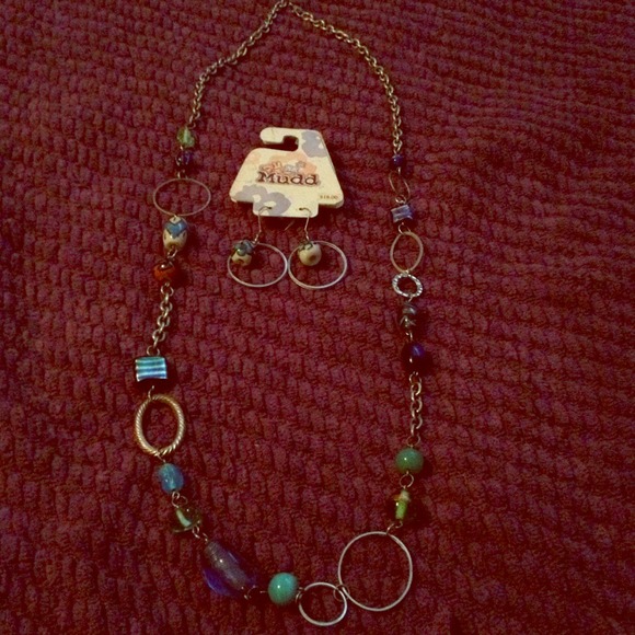 Long necklace with matching earrings.