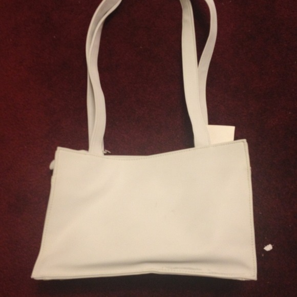 cute white purse with tags never used!