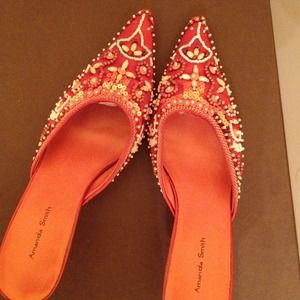 Worn orange beaded pumps
