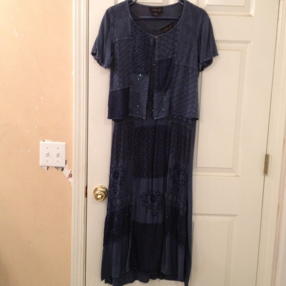 Denim looking dress with embroidery accents.