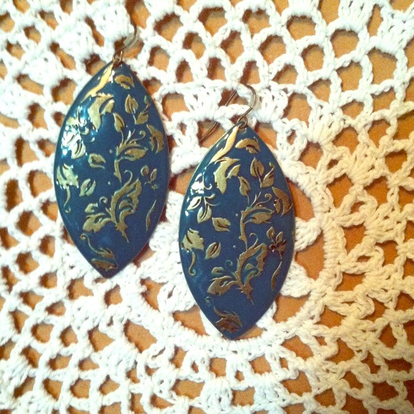 Beautiful teal earrings with gold design.