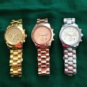 Yellow gold MK watch