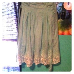 It's a teal with white lace dress strapless!