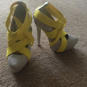 Victoria secrets grey with yellow straps shoes.