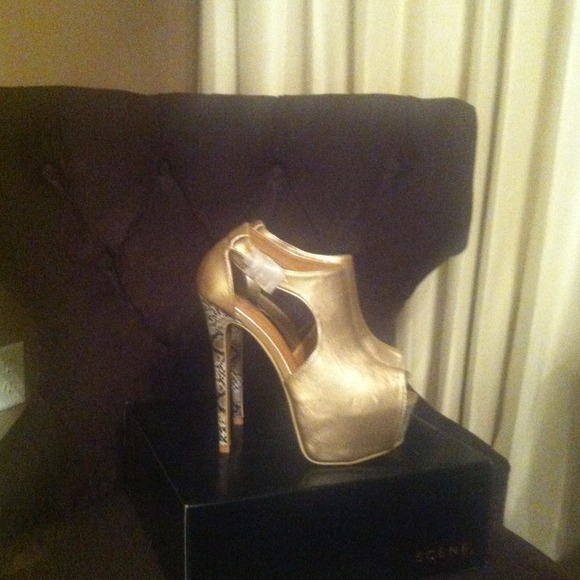 Very high & sexy gold shoes.