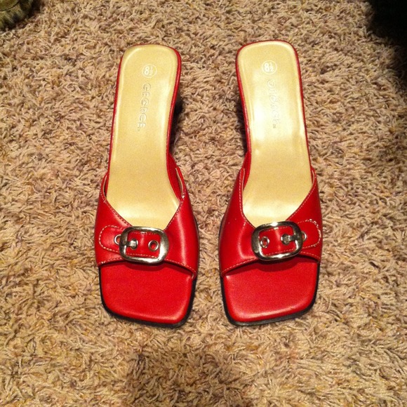 Red pumps with silver buckle