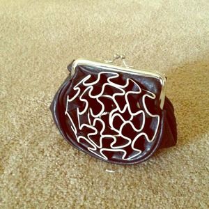 A plush black-white ruffled handbag