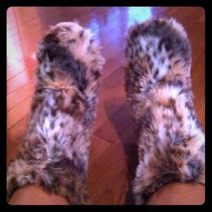 Leopard fur boots.