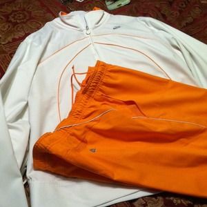 Jogging suit by Nike Orange and White.