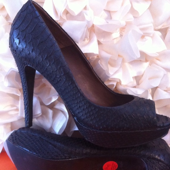 Snake embossed leather peep toe heels.