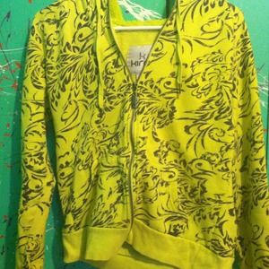 Bright yellow zip-up jacket, fuzzy inside.