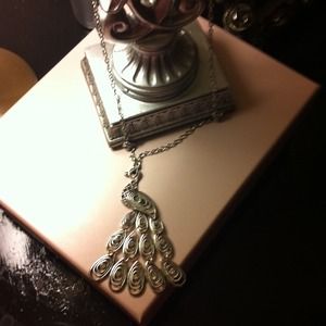 Long silver peacock necklace. New and never worn.