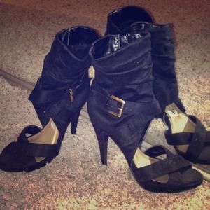 Black cutout heels with gold buckle