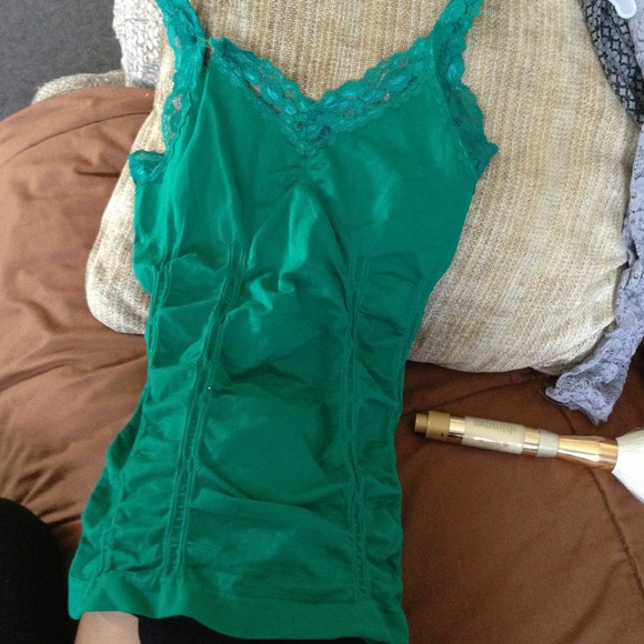 Tight fitting Green tanktop, shapes your body:)