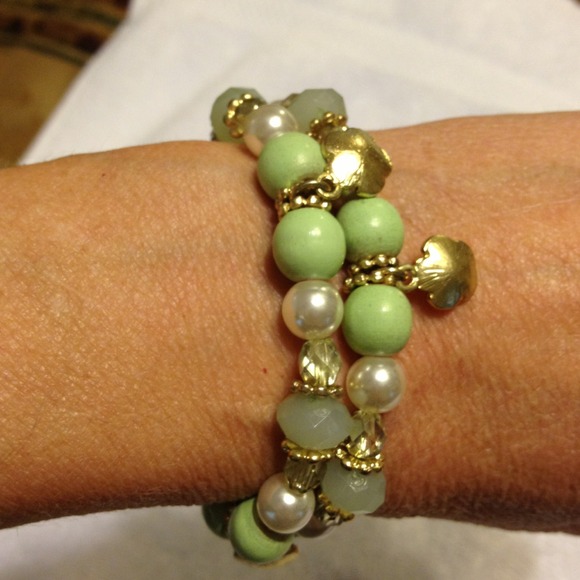Two green and gold beaded matching bracelets