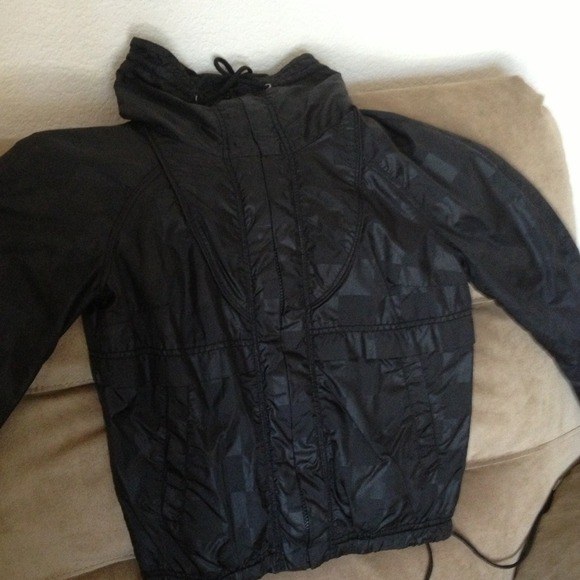 Black windbreaker.