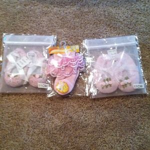 Bundle of brand new newborn booties and socks