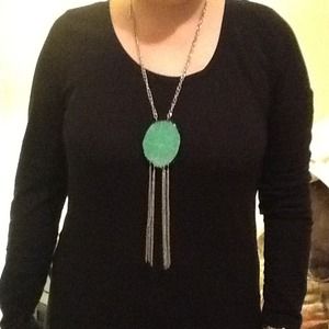 Silver w/ green stone. 30 inches long.