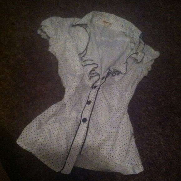 Polka dot shirt.
