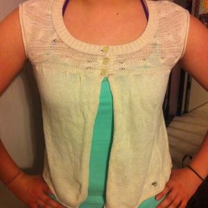 Cream colored sleeveless shrug/sweater