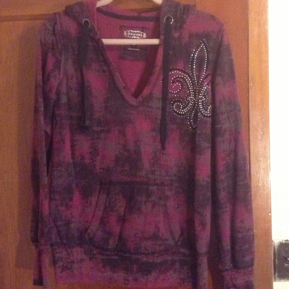 Hooded sweatshirt with thumb holes.