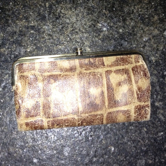 Hobo double-framed clutch wallet in tortoise.