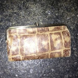 Hobo double-framed clutch wallet in tortoise.