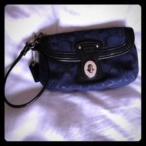 Navy Coach wristlet with black patent leather