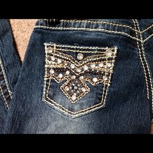 Pair of jeans with embellished pockets