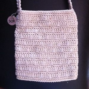 The Sak - cream colored purse/shoulder bag.