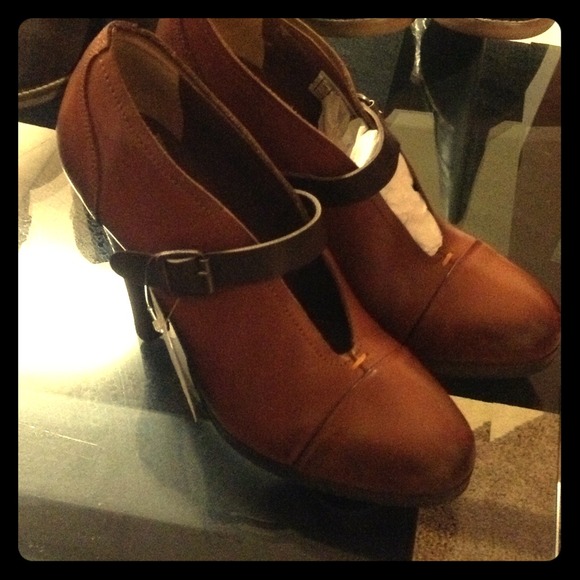Rust brown leather shoes.