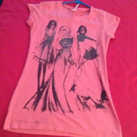 A pink top with girls on it
