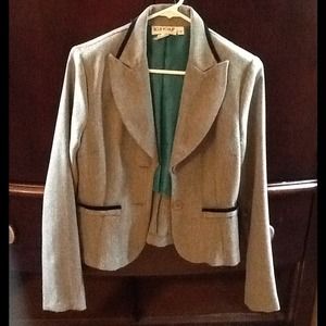 Heather gray blazer with black trim.