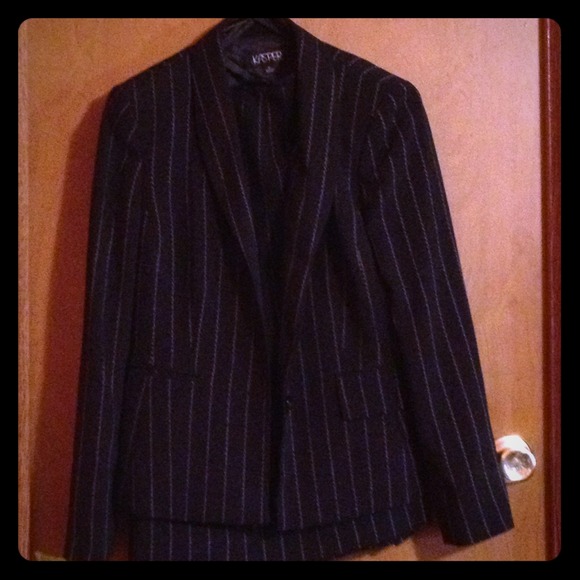 Black pinstripe Kasper suit .