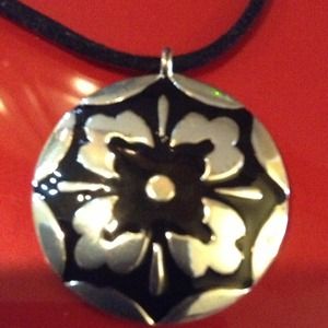 Black enamel flower pendant