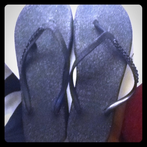 Sparkly flip flops with heart charm