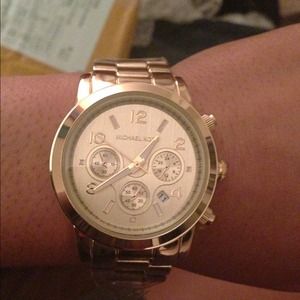 Gold Michael Kors watch.