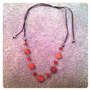 Slider suede and butterscotch glass necklace.