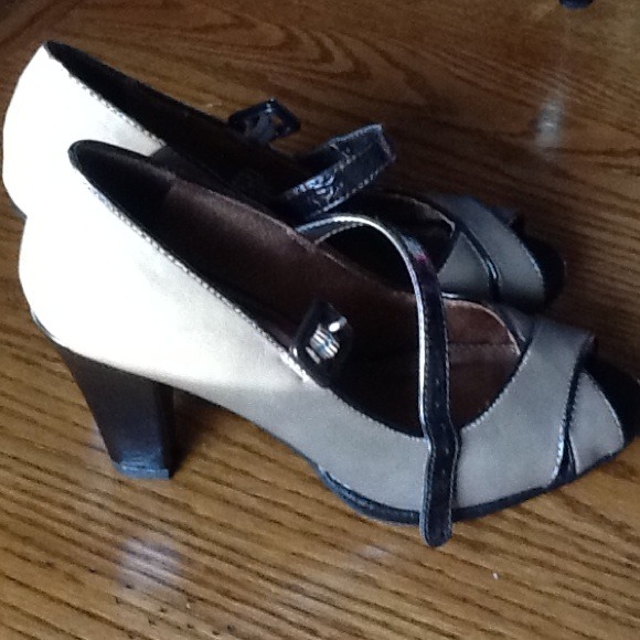 Brown peep toe Mary Jane pumps.