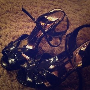Bcbg patent leather strappy shoe. Very high heel!